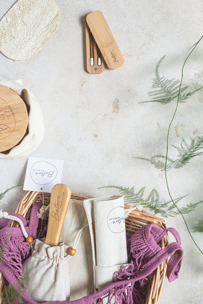 Reusable beauty tools displayed in a stylish wicker basket, emphasizing sustainability.